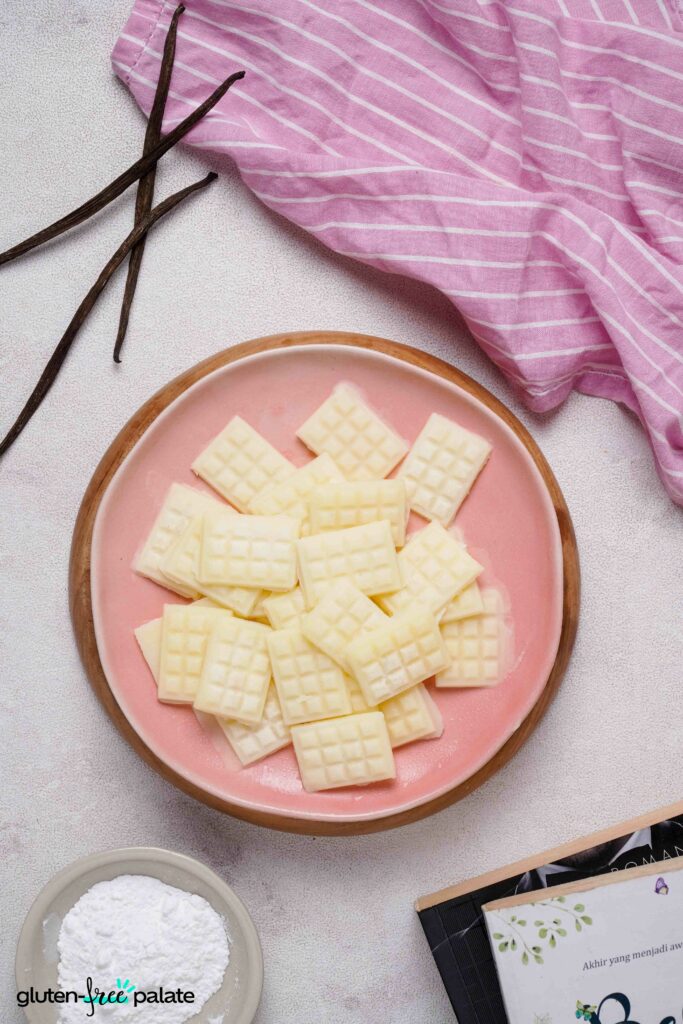 Overhead view of Vegan White chocolate on a pink plate.