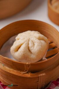 Gluten-Free Bao Bun in a steamer basket.
