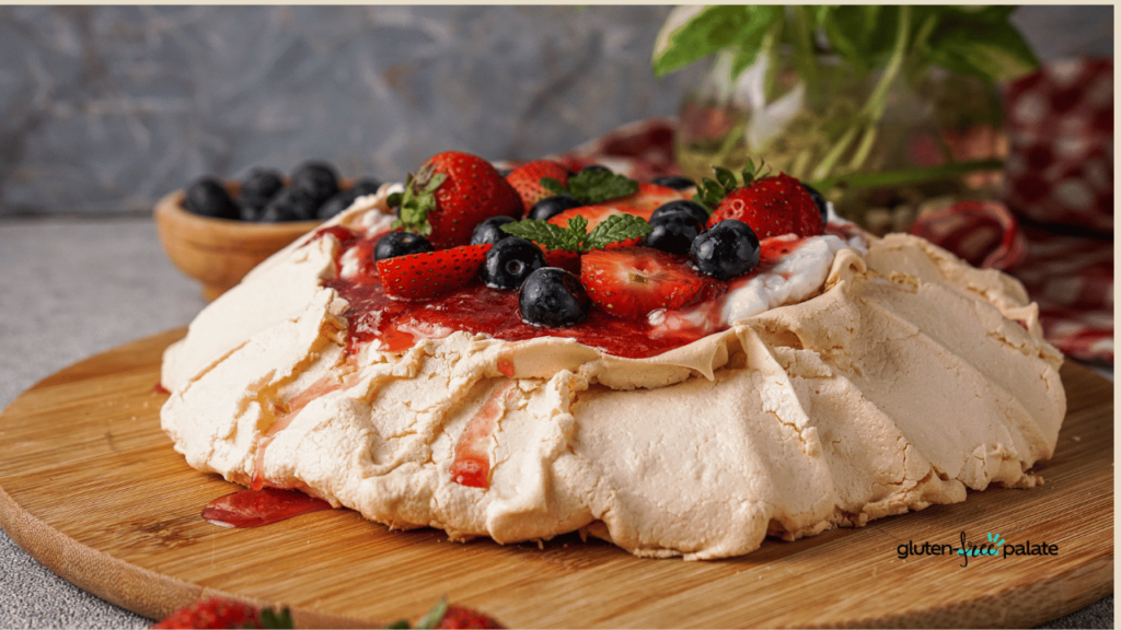 A pavlova dessert topped with fresh berries.