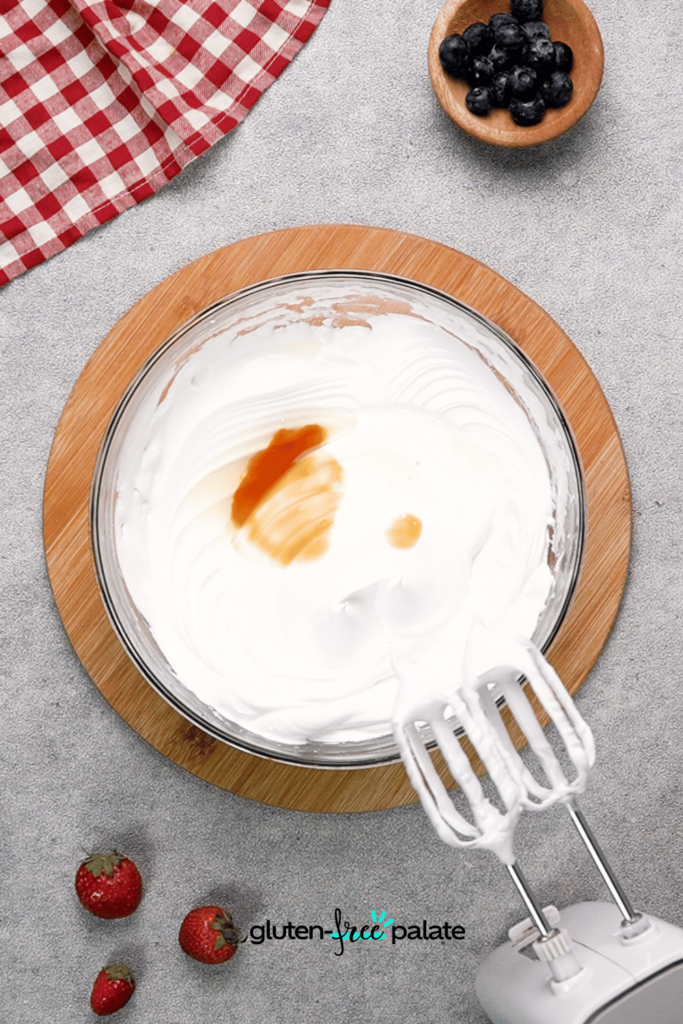 Whip the egg whites together with a mixer.