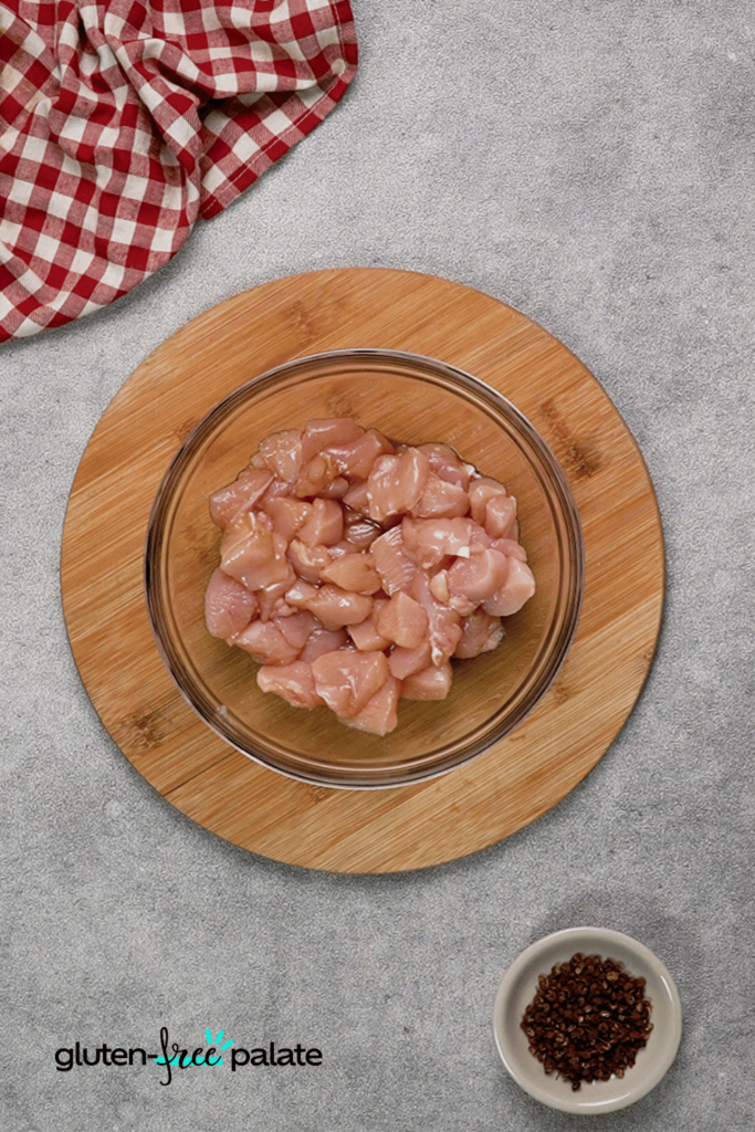 First, cut your chicken into cubes.