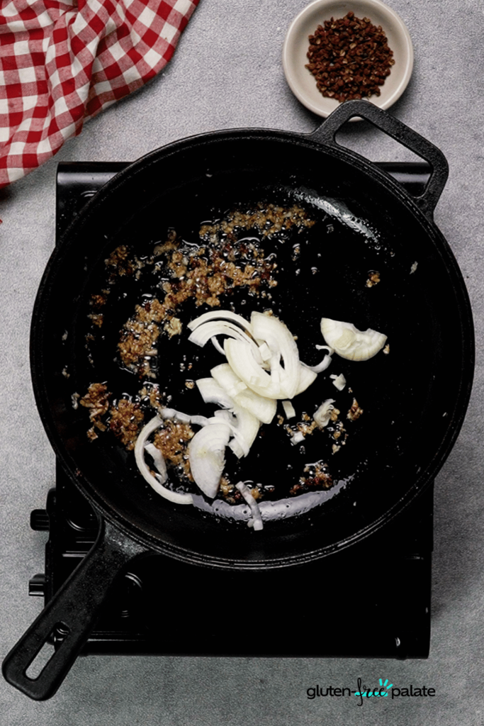 Add onions and, if you want some heat, dry chili peppers.