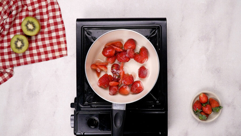 Add fruit, juice, and sugar to the saucepan.