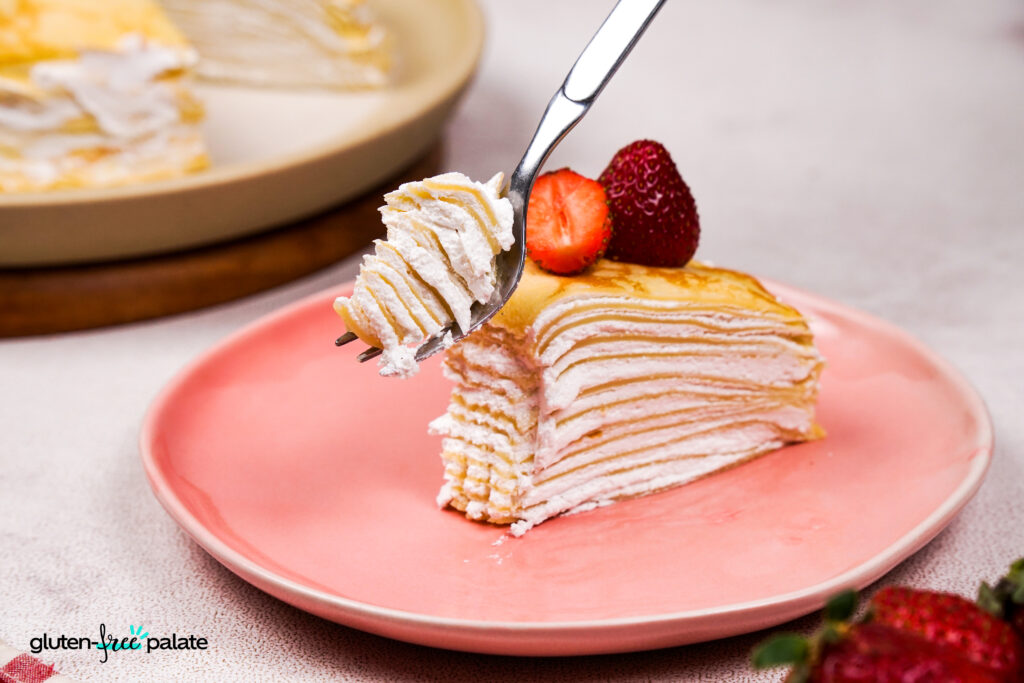 A fork with a piece of crepe cake. So many gooey layers. Photo by Gluten-Free Palate.