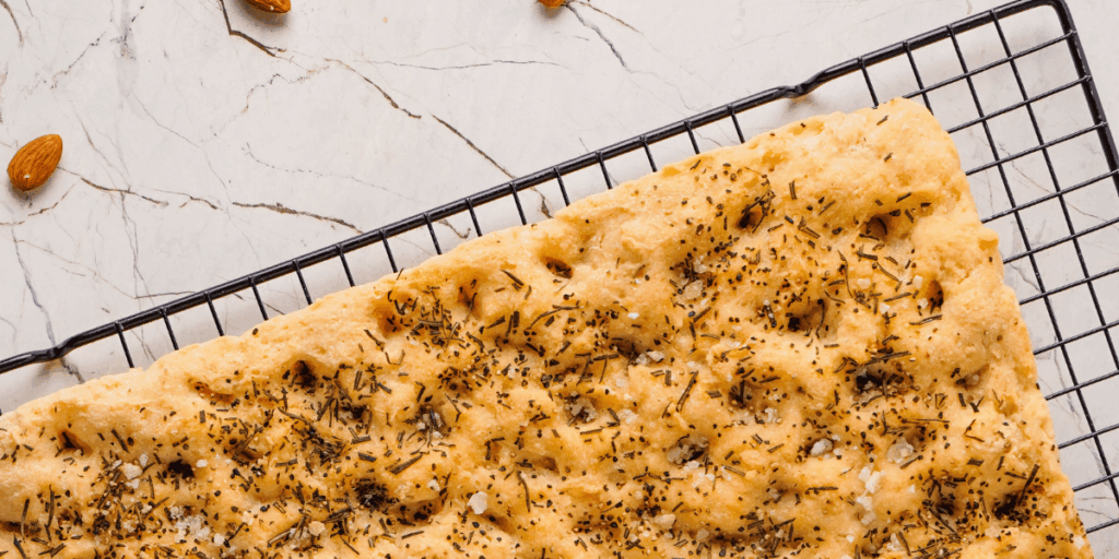 The crust of a gluten-free focaccia bread.