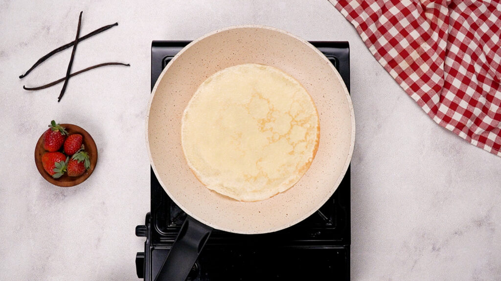 A crepe in a skillet. Photo by Gluten-Free Palate.