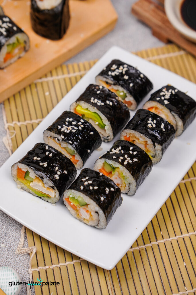 Sliced sushi rolls on a platter.