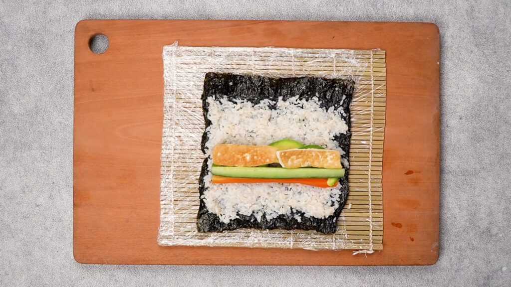 Filling placed on nori.