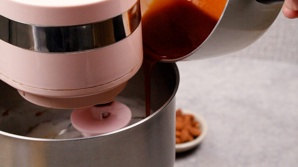 Adding the syrup to the peaks.