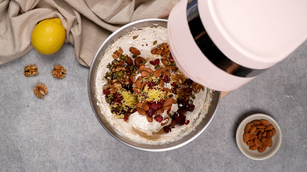 Adding in the nuts and other fillings.