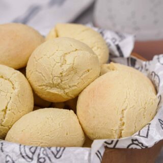 A close-up of a basket of gluten-free cheese rolls.