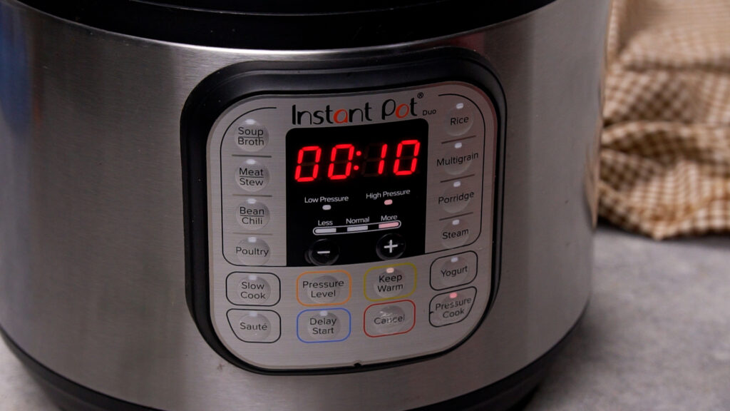 Step 5 An Instant Pot timer set to 10 minutes of high-pressure cooking, showing its countdown display.