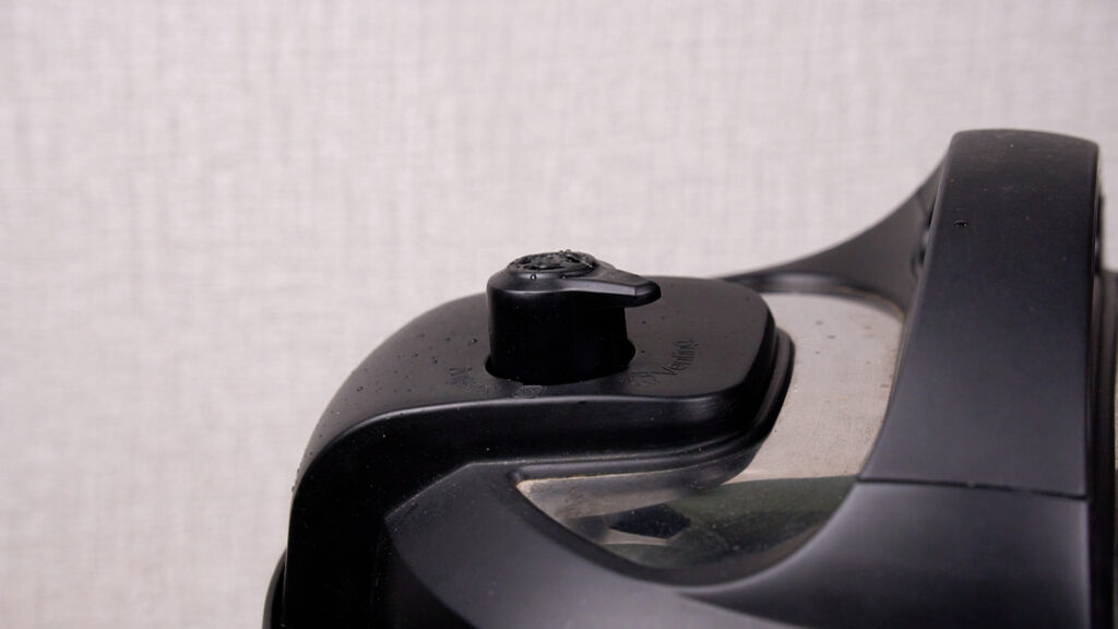 Step 6 Close-up of the Instant Pot steam release valve in the locked position during pressure cooking.