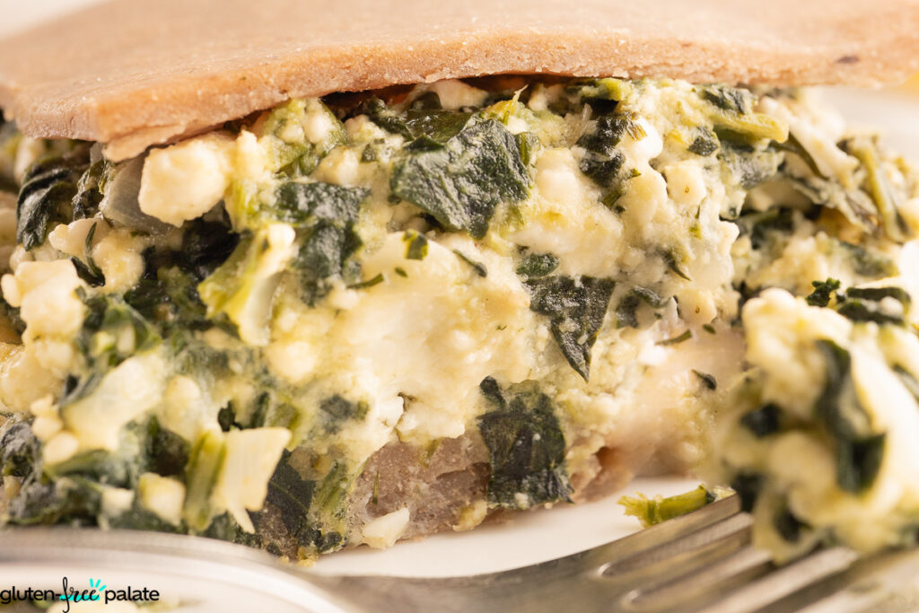 Side view of Gluten-Free Spanakopita showing spinach, dill and feta cheese.