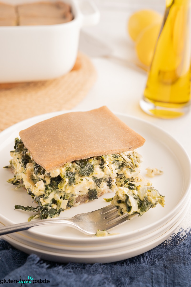 3/4 view of Gluten-Free Spanakopita showing the gluten-free phyllo crust and the filling of spinach, dill and feta cheese.