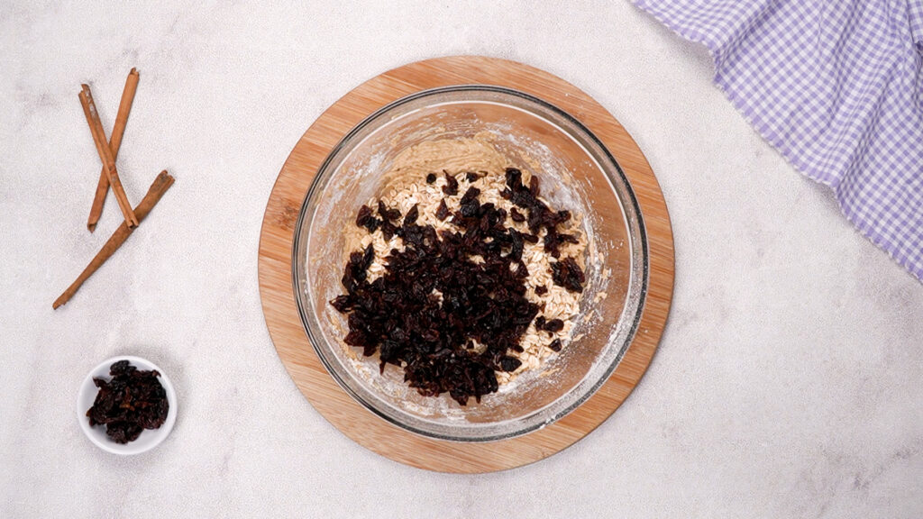 The dough is now mixed and oats and raisins have been added.