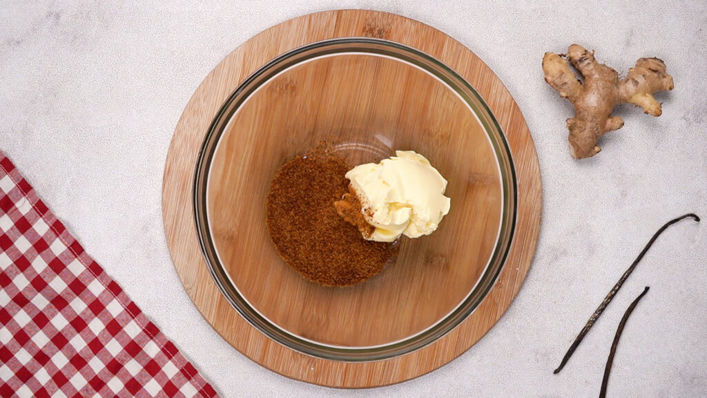 Bowl with softened butter and brown sugar ready to be creamed.