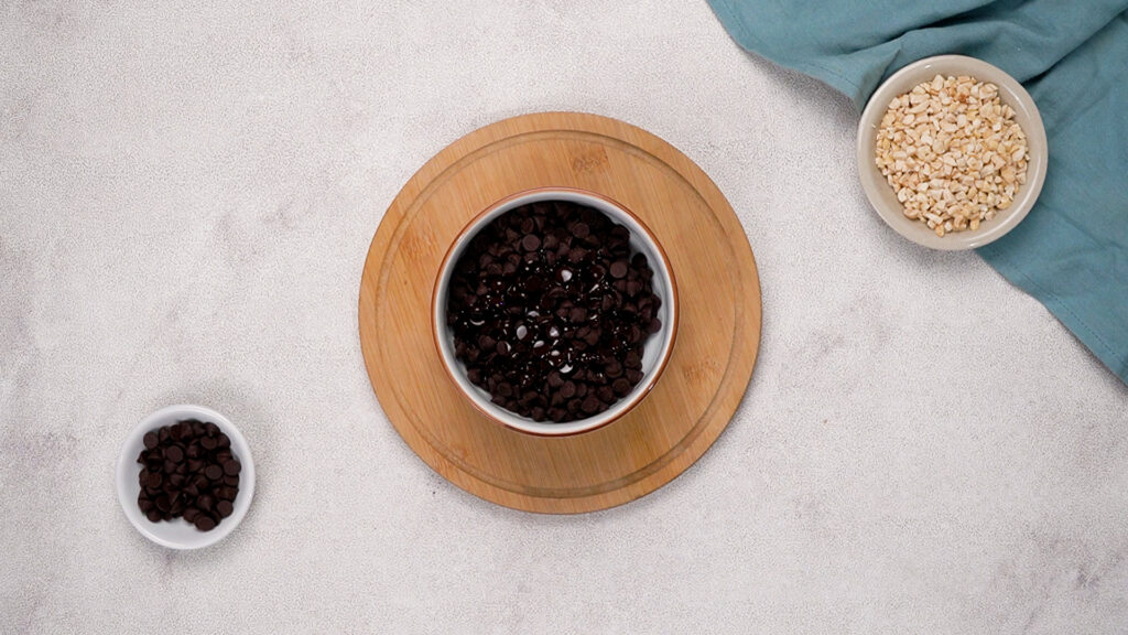 Small bowl filled with chocolate chips ready for melting.