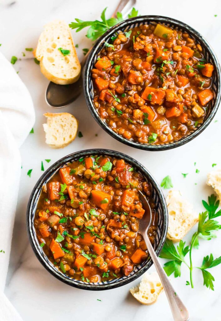 Two bowls of slow cooker lentil soup.