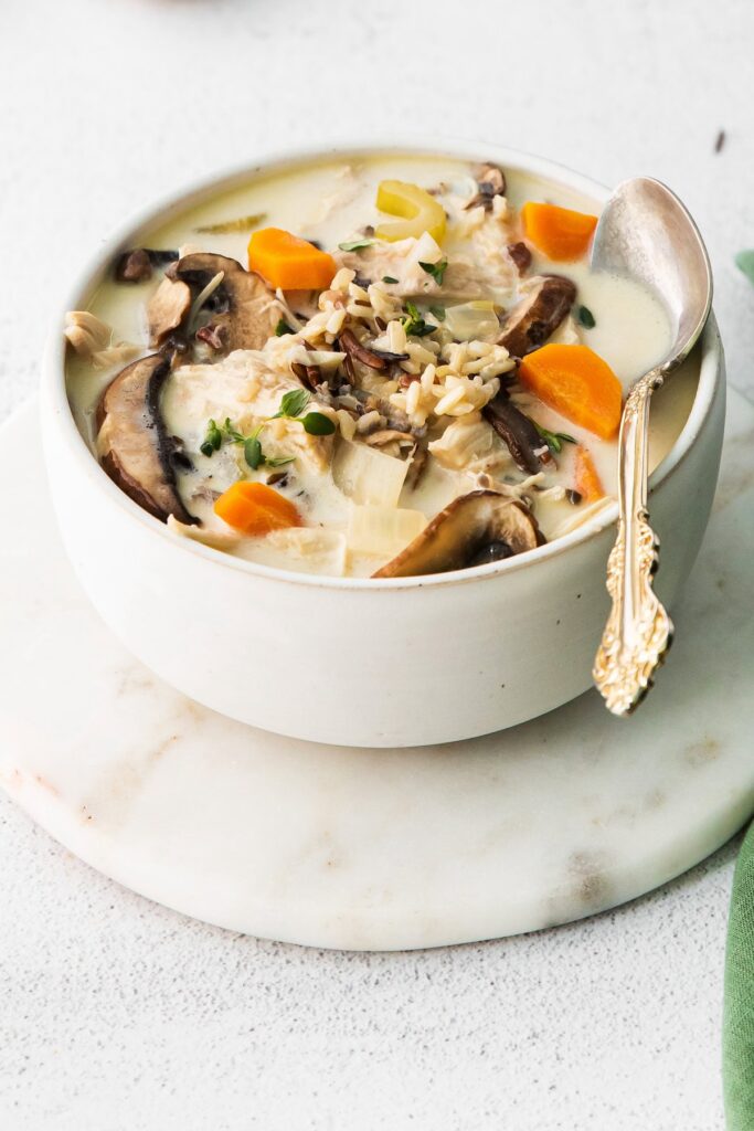 Chicken and rice soup in a soup bowl.