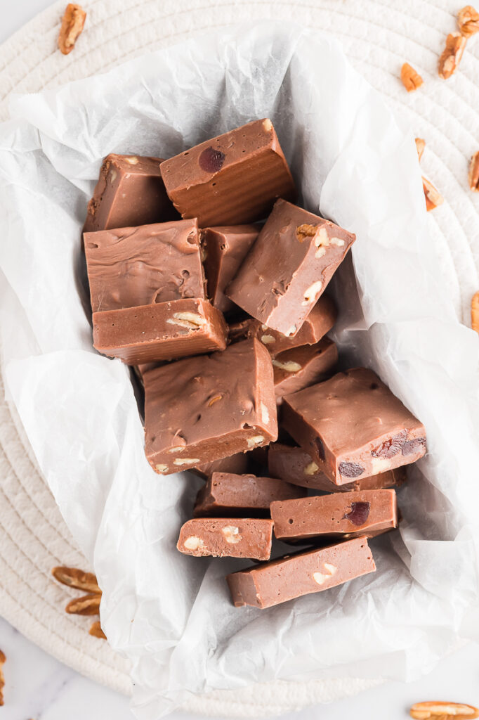 Fantasy Fudge in baking pan with parchment paper.