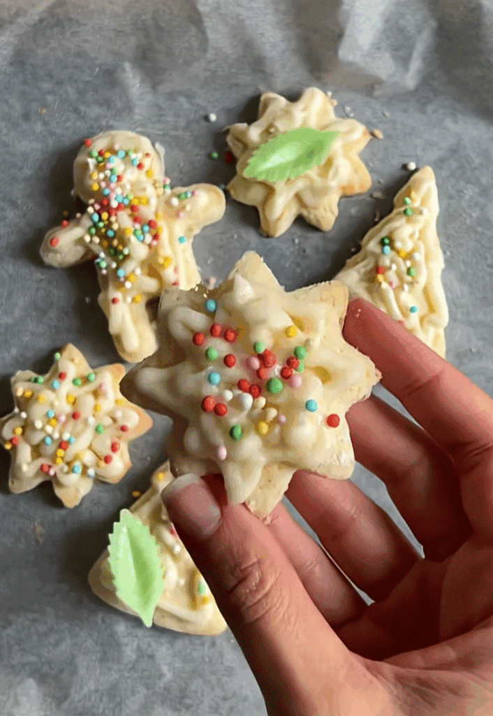 A star shaped sugar Christmas cookie made with gluten-free ingredients.
