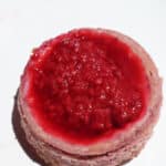 Close up of one mini raspberry cheesecake.