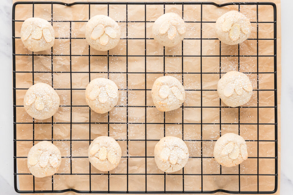 Almond cookies on a cooling rack.