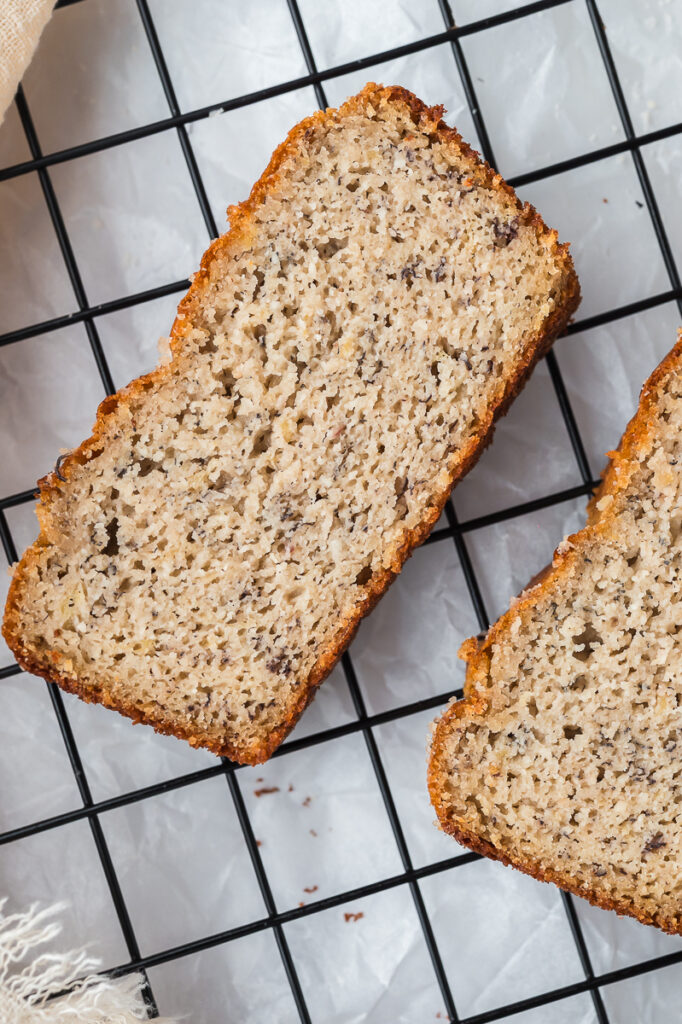 Multiple slices of almond flour banana bread arranged to show the soft texture and golden crust.