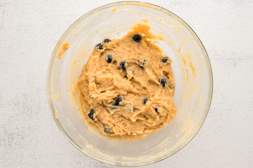 Mashed ripe bananas in a small bowl ready to add to almond flour muffin batter