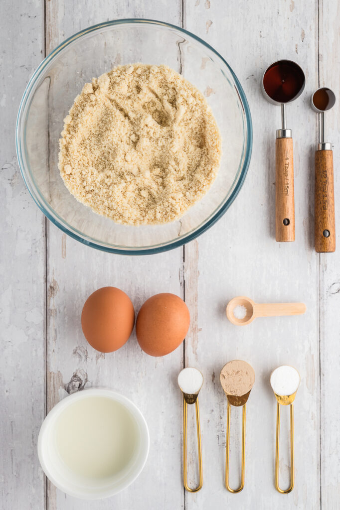Almond flour pancake ingredients laid out including almond flour, eggs, and almond milk