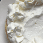 An overhead view of lemon cheesecake with lemon curd.