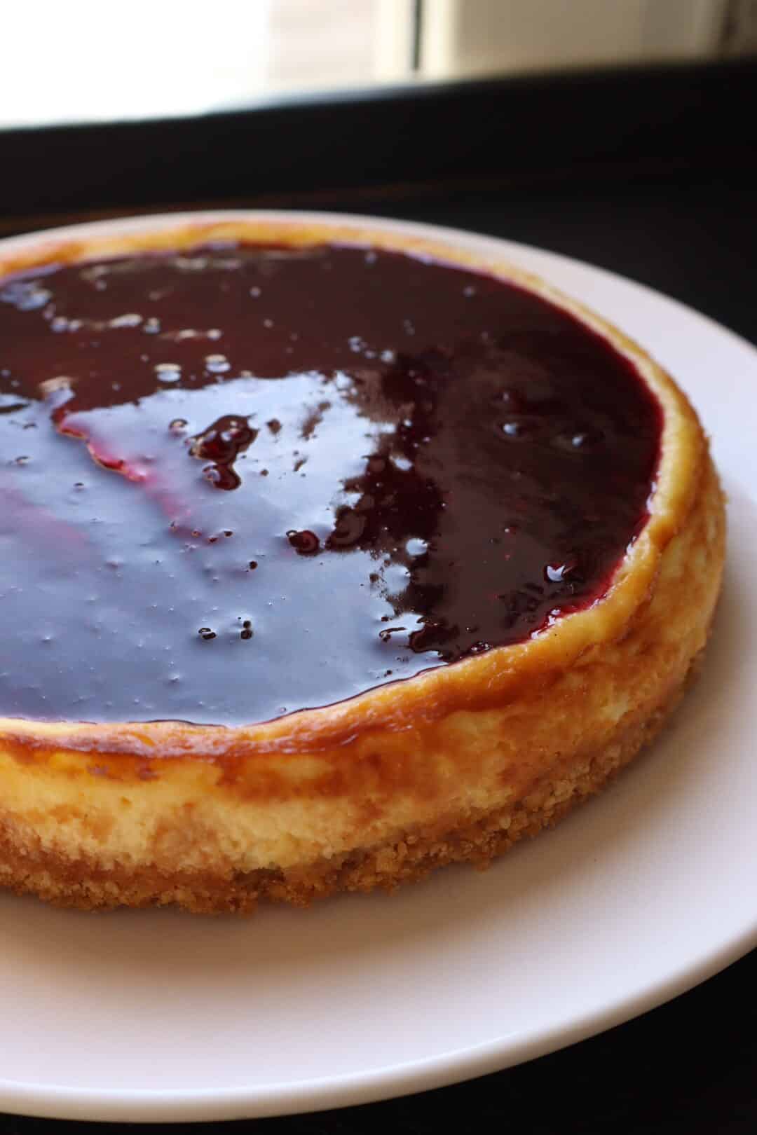 Gluten-Free Blueberry Cheesecake on a white plate.