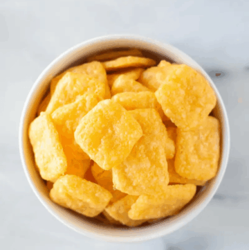 A bowl of gluten free cheez it crackers shown from above